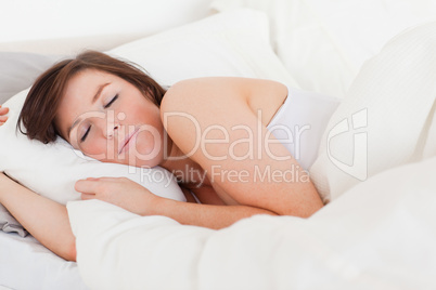 Attractive brunette female having a rest while lying