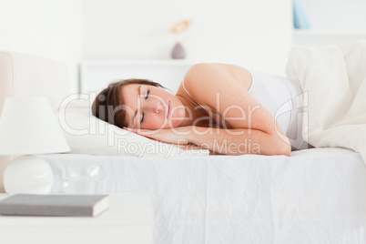 Lovely brunette woman having a rest while lying