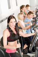 Fitness young group on elliptical cross trainer