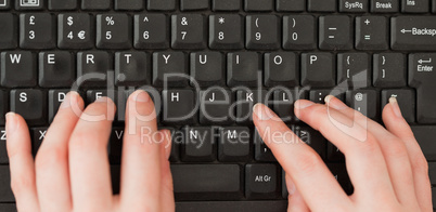 Woman hands typing on a screen