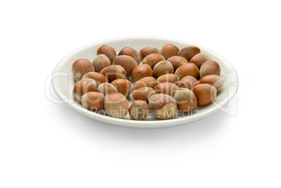 Nuts in a plate, isolated on white background