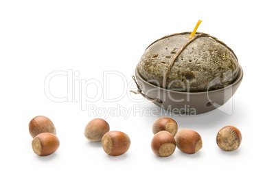 Hazelnuts and Candle, isolated on white background