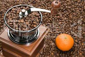 Old coffee grinder and Orange
