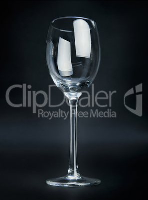 Empty wineglass on black background