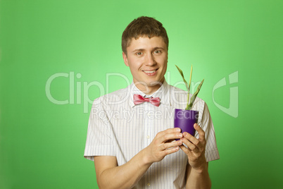 Man observes cultivation of young plants