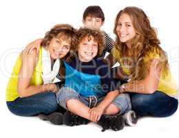 Happy young smiling family with two boys