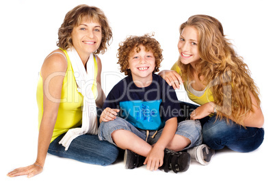 Family having fun on the floor, smiling at camera