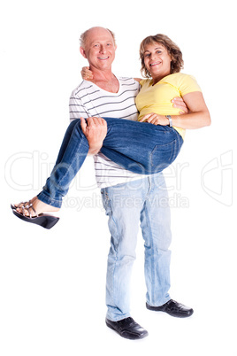 Playful senior couple having fun indoors