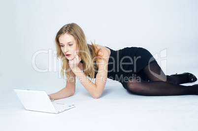 Attractive blonde girl with laptop