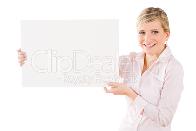 Happy businesswoman holding aside empty banner
