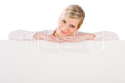 Businesswoman leaning over empty banner