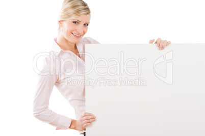 Happy businesswoman behind empty banner landscape