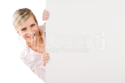 Happy businesswoman behind empty banner landscape