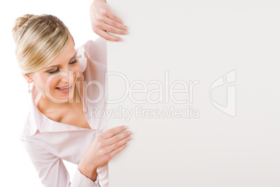 Businesswoman looking down at empty banner
