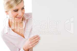 Businesswoman looking down at empty banner