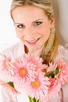 Romantic woman hold pink gerbera daisy