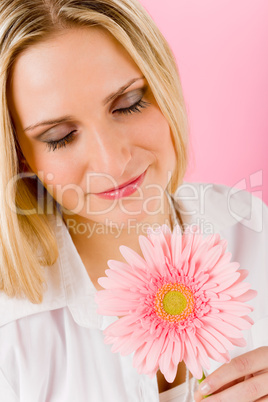 Romantic woman hold pink gerbera daisy flower