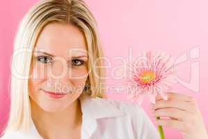 Romantic woman hold pink gerbera daisy flower