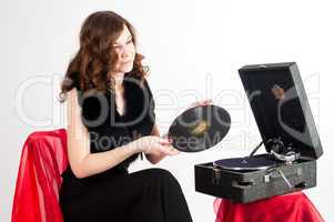 Beautiful woman with gramophone,