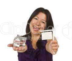 Multiethnic Woman Holding Small Blank Real Estate Sign and House