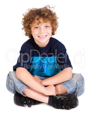 Cheerful kid relaxing on floor
