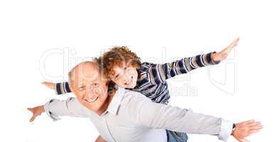 Grandfather giving grandson piggy-back
