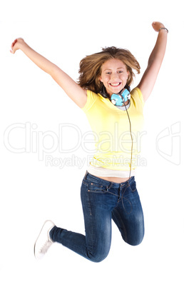 Girl jumping high with headphones around her neck