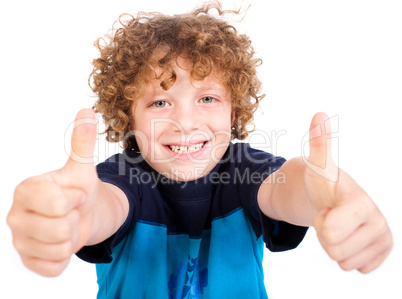 Smilling cute little boy gesturing thumbs up