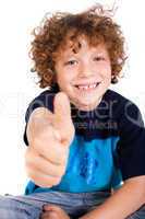 Casual young kid showing thumbs up