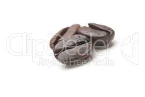 Three Roasted Coffee Beans on White