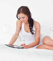 Beautiful young woman with a tablet