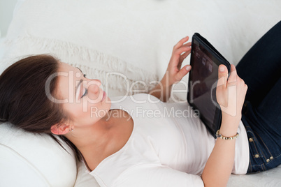 Close up of a young woman using a tablet