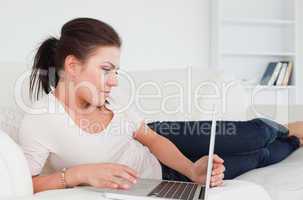 Close up of a beatiful woman looking at her laptop