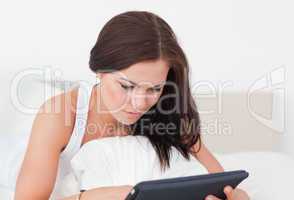 Close up of a young woman with a tablet