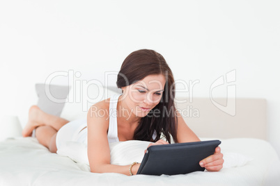 Cute young woman with a tablet