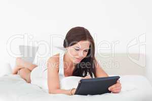 Cute young woman with a tablet