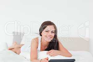 Smiling cute woman with a tablet