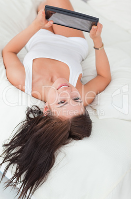 Portrait of a smiling brunette with a tablet Portrait of a smiling brunette with a tablet