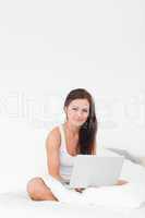 Portrait of a young woman with her laptop