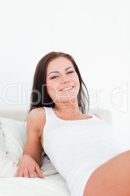 Close up of a smiling  brunette posing