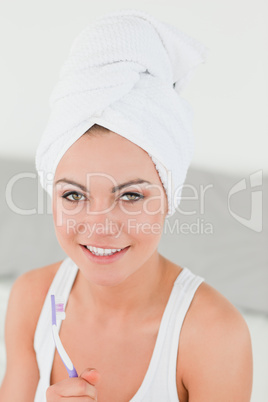 Cute woman about to brush her teeth