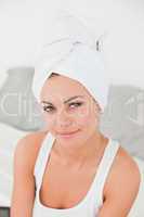 Portrait of a woman with the hair wrapped into a towel