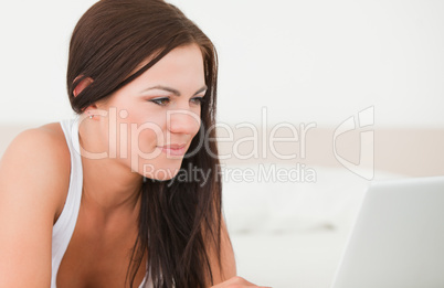 Close up of a young woman surfing on the internet