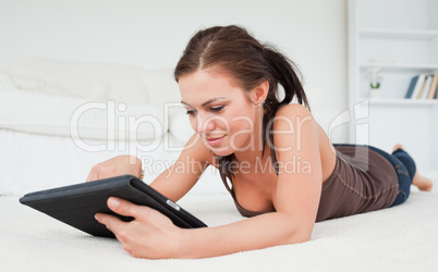 Young woman playing with her tablet