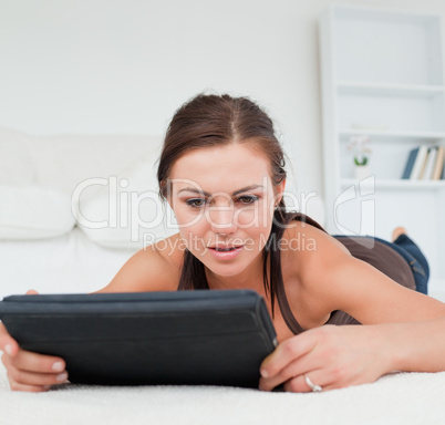 Pensive woman working on her tablet