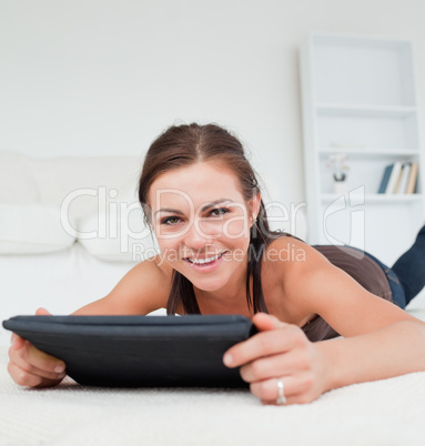 Cute woman working on her tablet