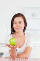 Young woman showing an apple