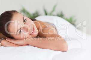 Close up of a cute woman lying on a massage table