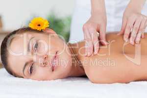 Beautiful woman having a shoulder massage