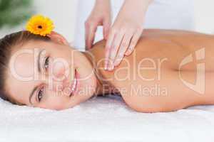 Close up of a beautiful woman having a shoulder massage